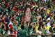 Mexico's fans celebrate holding a mask of Mexico's head coach Miguel Herrera after the group A World Cup soccer match between Croatia and Mexico at the Arena Pernambuco in Recife, Brazil, Monday, June 23, 2014. Mexico won 3-1. (AP Photo/Ricardo Mazalan)
