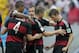 Germany's Thomas Mueller, right, celebrates scoring the opening goal during the group G World Cup soccer match between the USA and Germany at the Arena Pernambuco in Recife, Brazil, Thursday, June 26, 2014. (AP Photo/Matthias Schrader)