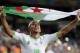 Algeria's Sofiane Feghouli celebrates after the group H World Cup soccer match between Algeria and Russia at the Arena da Baixada in Curitiba, Brazil, Thursday, June 26, 2014. The match ended in a 1-1 draw, but Algeria qualified for the round of 16. (AP Photo/Ivan Sekretarev)