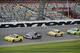 Matt Kenseth (20), Denny Hamlin (11), Kyle Busch (18) and Paul Menard (27) run laps during a practice session for the Daytona 500 NASCAR Sprint Cup Series auto race at Daytona International Speedway in Daytona Beach, Fla., Friday, Feb. 21, 2014. (AP Photo/Phelan M. Ebenhack)