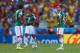 FORTALEZA, BRAZIL - JUNE 29: Hector Herrera (L) and Javier Hernandez of Mexico look on after allowing a goal during the 2014 FIFA World Cup Brazil Round of 16 match between Netherlands and Mexico at Castelao on June 29, 2014 in Fortaleza, Brazil. (Photo by Michael Steele/Getty Images)