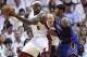 Miami Heat small forward LeBron James (6) looks to pass as New York Knicks' Carmelo Anthony defends in the second half during an NBA basketball game in the first round of the Eastern Conference playoffs in Miami, Monday, April 30, 2012. The Heat defeated the Knicks 104-94. (AP Photo/Lynne Sladky)