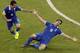 Greece's Sokratis Papastathopoulos, right, celebrates scoring his side's first goal during the World Cup round of 16 soccer match between Costa Rica and Greece at the Arena Pernambuco in Recife, Brazil, Sunday, June 29, 2014. (AP Photo/Hassan Ammar)