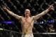 Stefan Struve celebrates after beating Christian Morecraft by TKO in the second round during a heavyweight UFC mixed martial arts match in Oakland, Calif., Saturday, Aug. 7, 2010. (AP Photo/Jeff Chiu)