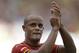 Belgium's Vincent Kompany applauds following Belgium's 1-0 victory over Russia during the group H World Cup soccer match between Belgium and Russia at the Maracana Stadium in Rio de Janeiro, Brazil, Sunday, June 22, 2014. (AP Photo/Natacha Pisarenko)