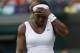 Serena Williams of U.S. gestures after losing a point to Alize Cornet of France during their women's singles match at the All England Lawn Tennis Championships in Wimbledon, London, Saturday, June 28, 2014. (AP Photo/Sang Tan)