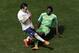 France's Mathieu Valbuena, left, and Nigeria's Juwon Oshaniwa challenge for the ball during the World Cup round of 16 soccer match between France and Nigeria at the Estadio Nacional in Brasilia, Brazil, Monday, June 30, 2014. (AP Photo/Hassan Ammar)
