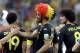 Belgium's Nacer Chadli, left, is congratulated by a teammate following Belgium's 1-0 victory over South Korea to Belgium during the group H World Cup soccer match between South Korea and Belgium at the Itaquerao Stadium in Sao Paulo, Brazil, Thursday, June 26, 2014. (AP Photo/Thanassis Stavrakis)