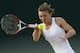 Simona Halep of Romania plays a return to Belinda Bencic of Switzerland during their women's singles match at the All England Lawn Tennis Championships in Wimbledon, London, Saturday, June 28, 2014. (AP Photo/Alastair Grant)