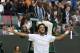 Feliciano Lopez of Spain celebrates after defeating John Isner of the U.S. during their men's singles match at the All England Lawn Tennis Championships in Wimbledon, London, Monday, June 30, 2014. (AP Photo/Sang Tan)