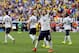 France's Mathieu Valbuena celebrates after Nigeria's Joseph Yobo scored an own goal during the World Cup round of 16 soccer match between France and Nigeria at the Estadio Nacional in Brasilia, Brazil, Monday, June 30, 2014. (AP Photo/David Vincent)