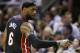 Miami Heat forward LeBron James (6) gestures to the bench during the first half in Game 5 of the NBA basketball finals against the San Antonio Spurs on Sunday, June 15, 2014, in San Antonio. (AP Photo/David J. Phillip)