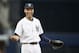 New York Yankees shortstop Derek Jeter reacts to a coach while waiting for the start of a baseball game against the Oakland Athletics at Yankee Stadium in New York, Wednesday, June 4, 2014. (AP Photo/Kathy Willens)