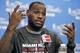 FILE - In this June 14, 2014 file photo, Miami Heat forward LeBron James responds to a question during a media availability for the NBA basketball finals in San Antonio. A person familiar with the situation tells The Associated Press that James has decided to opt out of the final two years of his contract with the Heat and become a free agent on July 1. Opting out does not mean James has decided to leave the Heat, said the person, who spoke on condition of anonymity because neither the four-time NBA MVP nor the team had made any public announcement. (AP Photo/Tony Gutierrez, File)