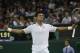 Novak Djokovic of Serbia celebrates defeating Jo-Wilfried Tsonga of France in their men's singles match at the All England Lawn Tennis Championships in Wimbledon, London, Monday, June 30, 2014. (AP Photo/Pavel Golovkin)