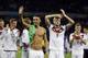 Germany's Mesut Ozil, left, and teammate Andre Schuerrle (9) celebrate after Germany defeated Algeria 2-1 in extra time during the World Cup round of 16 soccer match between Germany and Algeria at the Estadio Beira-Rio in Porto Alegre, Brazil, Monday, June 30, 2014. (AP Photo/Kirsty Wigglesworth)