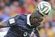 France's Mamadou Sakho heads the ball during the group E World Cup soccer match between France and Honduras at the Estadio Beira-Rio in Porto Alegre, Brazil, Sunday, June 15, 2014. (AP Photo/David Vincent)