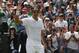 Roger Federer of Switzerland celebrates defeating Tommy Robredo of Spain in their men's singles match at the All England Lawn Tennis Championships in Wimbledon, London, Tuesday July 1, 2014. (AP Photo/Pavel Golovkin)