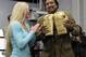 This Jan. 13, 2010 image shows Albuquerque boxer Holly Holm presenting a ceremonial pair of golden gloves to Gov. Bill Richardson during a news conference in Albuquerque, N.M. Conservationists gave the gloves to Richardson for helping lead the fight to keep oil and gas development off of southern New Mexico's Otero Mesa. (AP Photo/Susan Montoya Bryan)