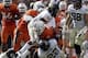 Wake Forest's Merrill Noel and Ryan Janvion (22) take down Miami's Duke Johnson (8) during an NCAA college football game, Saturday, Oct. 26, 2013, in Miami Gardens, Fla. Miami won 24-21. (AP Photo/Alan Diaz)