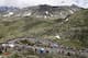 The pack of riders climb in the Swiss Alps during the 16th stage, a 159 km race from Martigny to Bourg-Saint-Maurice in France, at the 96th Tour de France cycling race, near the Great St Bernard Pass, Switzerland, Tuesday, July 21, 2009. (AP Photo/Keystone/Jean-Christophe Bott)