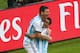 PORTO ALEGRE, BRAZIL - JUNE 25: Lionel Messi of Argentina (L) celebrates scoring his team's first goal with Angel di Maria during the 2014 FIFA World Cup Brazil Group F match between Nigeria and Argentina at Estadio Beira-Rio on June 25, 2014 in Porto Alegre, Brazil. (Photo by Quinn Rooney/Getty Images)