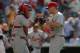 Yadier Molina and Trevor Rosenthal celebrate after a win against the Rockies on June 25.
