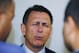 Detroit Red Wings General Manager Ken Holland winces as he talks to reporters after the Red Wings lost to the San Jose Sharks 3-2 in Game 7 of an NHL hockey Stanley Cup Western Conference semifinal playoff series Thursday, May 12, 2011, in San Jose, Calif. (AP Photo/Paul Sakuma)