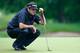CROMWELL, CT - JUNE 19: Bubba Watson of the United States studies his putt on the 15th hole during the first round of the Travelers Championship golf tournament at the TPC River Highlands on June 19, 2014 in Cromwell, Connecticut. (Photo by Jared Wickerham/Getty Images)