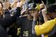 Pittsburgh Pirates' Gregory Polanco (25) is greeted by teammates in the dugout after hitting a three-run home run against the New York Mets in the fifth inning of a baseball game Thursday, June 26, 2014, in Pittsburgh. (AP Photo/Keith Srakocic)