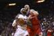 Washington Wizards' Marcin Gortat (4) blocks Miami Heat's LeBron James (6) during the first half of an NBA basketball game in Miami, Monday, March 10, 2014. (AP Photo/J Pat Carter)
