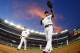 NEW YORK, NY - JUNE 28: Masahiro Tanaka #19 and Brian Roberts #14 of the New York Yankees walk off the field after the fifth inning against the Boston Red Sox in a MLB baseball game at Yankee Stadium on June 28, 2014 in the Bronx borough of New York City. (Photo by Rich Schultz/Getty Images)
