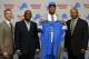 From left to right, Detroit Lions president Tom Lewand, general manager Martin Mayhew, NFL football first-round draft choice North Carolina tight end Eric Ebron and head coach Jim Caldwell pose before a news conference in Allen Park, Mich., Friday, May 9, 2014. (AP Photo/Paul Sancya)