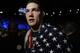 Chris Weidman, of Baldwin, N.Y., walks after defeating Anderson Silva, of Brazil, during the UFC 168 mixed martial arts middleweight championship bout on Saturday, Dec. 28, 2013, in Las Vegas. Weidman won during the second round by a technical knockout after Silva was injured. (AP Photo/David Becker)