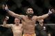Johny Hendricks, center, reacts following a UFC 167 mixed martial arts championship welterweight bout on against Georges St. Pierre, of Canada, on Saturday, Nov. 16, 2013, in Las Vegas. St. Pierre won by split decision. (AP Photo/Isaac Brekken)