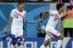 Costa Rica's Yeltsin Tejeda (17) and Oscar Granados celebrate after Costa Rica defeated Greece 5-3 in penalty shootouts after a 1-1 tie during the World Cup round of 16 soccer match between Costa Rica and Greece at the Arena Pernambuco in Recife, Brazil, Sunday, June 29, 2014. (AP Photo/Petr David Josek)