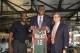 Milwaukee Bucks first round draft pick Jabari Parker is flanked by coach Larry Drew, left, and general manager John Hammond as he is introduced at a news conference Friday, June 27, 2014, in Milwaukee. (AP Photo/Morry Gash)