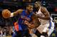 Apr 16, 2014; Oklahoma City, OK, USA; Detroit Pistons forward Greg Monroe (10) drives to the basket against Oklahoma City Thunder forward Serge Ibaka (9) during the first quarter at Chesapeake Energy Arena. Mandatory Credit: Mark D. Smith-USA TODAY Sports