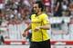 Dortmund's Mats Hummels runs with the ball during a match of German Bundesliga between VfB Stuttgart and Borussia Dortmund in Stuttgart, Germany, Saturday, March 29, 2014. (AP Photo/Michael Probst)