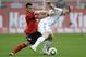 Leverkusen's Arturo Vidal, left, and Munich's Bastian Schweinsteiger challenge for the ball during the German first division Bundesliga soccer match between Bayer Leverkusen and Bayern Munich in Leverkusen, Germany, Saturday, April 10, 2010. (AP Photo/Martin Meissner) *EDS note: German spelling of Munich is Muenchen * **NO MOBILE USE UNTIL 2 HOURS AFTER THE MATCH, WEBSITE USERS ARE OBLIGED TO COMPLY WITH DFL-RESTRICTIONS, SEE INSTRUCTIONS FOR DETAILS **