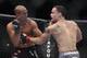 In this Aug. 28, 2010, photo, Frankie Edgar, right, and B.J. Penn trade blows during a UFC fight in Boston. Penn takes on John Fitch on Saturday in a welterweight bout in UFC 127 in Sydney. (AP Photo/Gregory Payan)