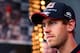 SPIELBERG, AUSTRIA - JUNE 19: Sebastian Vettel of Germany and Infiniti Red Bull Racing looks on as he signs autographs for fans ahead of the Austrian Formula One Grand Prix at Red Bull Ring on June 19, 2014 in Spielberg, Austria. (Photo by Mark Thompson/Getty Images)