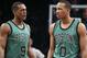 Boston Celtics guard Rajon Rondo (9) and guard Avery Bradley (0) wait for play to resume during the first half of an NBA basketball game against the Brooklyn Nets at the Barclays Center, Friday, March 21, 2014, in New York. The Nets defeated the Celtics, 114-98. (AP Photo/John Minchillo)