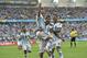 Argentina's Lionel Messi, left, is carried by his teammates Argentina's Angel di Maria (7) and Argentina's Marcos Rojo after scoring his side's first goal during the group F World Cup soccer match between Nigeria and Argentina at the Estadio Beira-Rio in Porto Alegre, Brazil, Wednesday, June 25, 2014. (AP Photo/Martin Meissner)