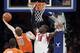 Syracuse's Trevor Cooney (10) drives past Louisville's Gorgui Dieng (10) during the first half of an NCAA college basketball championship game at the Big East Conference tournament Saturday, March 16, 2013, in New York. (AP Photo/Frank Franklin II)