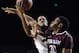 Fordham's Ryan Rhoomes, right, fouls Massachusetts' Raphiael Putney, left, during the second half of an NCAA college basketball game, Sunday, Jan. 26, 2014, in Amherst, Mass. Massachusetts won 90-52. (AP Photo/Jessica Hill)