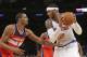 Washington Wizards' Trevor Ariza (1) defends New York Knicks' Carmelo Anthony (7) during the first half of an NBA basketball game Friday, April 4, 2014, in New York. (AP Photo/Frank Franklin II)