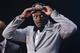 Kentucky forward Julius Randle dons a Los Angeles Lakers cap after being selected seventh overall by the Lakers during the 2014 NBA draft, Thursday, June 26, 2014, in New York. (AP Photo/Jason DeCrow)