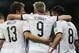 Germany's Mesut Ozil celebrates with this teammates Thomas Mueller and Andre Schuerrle after scoring his side's second goal in extra time during the World Cup round of 16 soccer match between Germany and Algeria at the Estadio Beira-Rio in Porto Alegre, Brazil, Monday, June 30, 2014. Germany defeated Algeria 2-1 to advance to the quarterfinals. (AP Photo/Matthias Schrader)