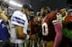 Dallas Cowboys quarterback Tony Romo (9) an Washington Redskins quarterback Robert Griffin III (10) greet each other after their NFL football game, Sunday, Oct. 13, 2013, in Arlington, Texas. The Cowboys won 31-16. (AP Photo/LM Otero)